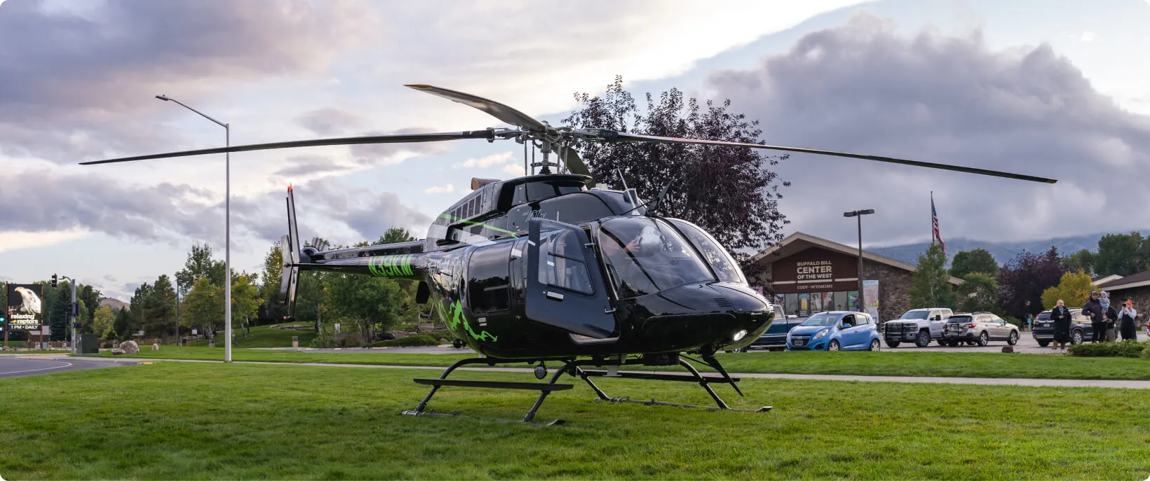 First Flight helicopter sitting in a field